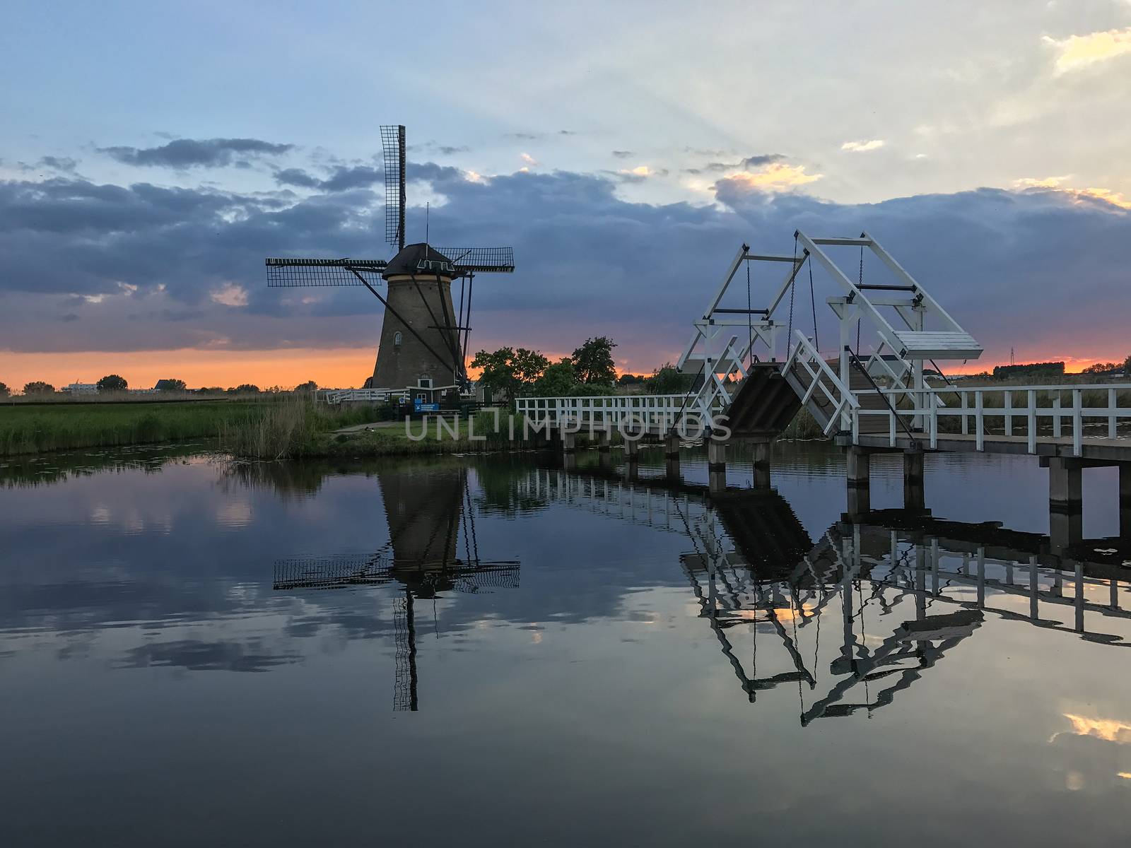 Beautiful dutch windmill landscape at the famous Kinderdijk canals, UNESCO world heritage site