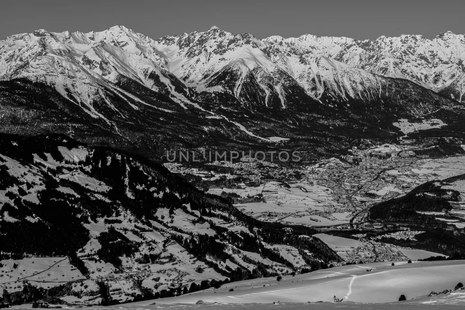 A village surrounded by mountains during winter