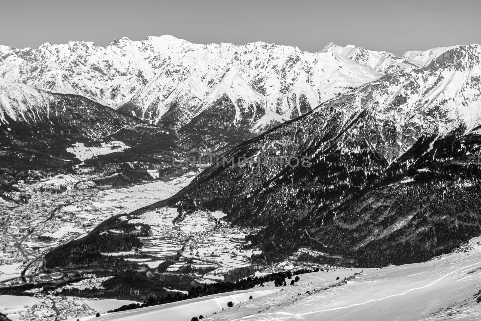 A village surrounded by mountains during winter