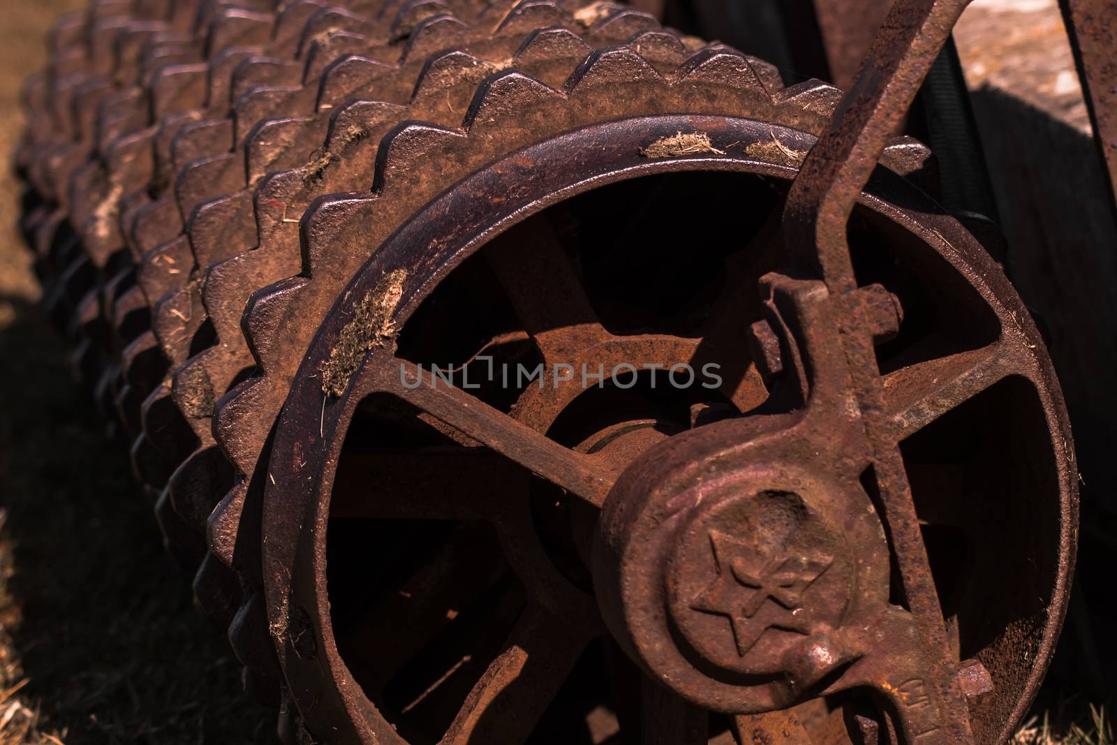 Closeup of a rusty old roller farm equipment