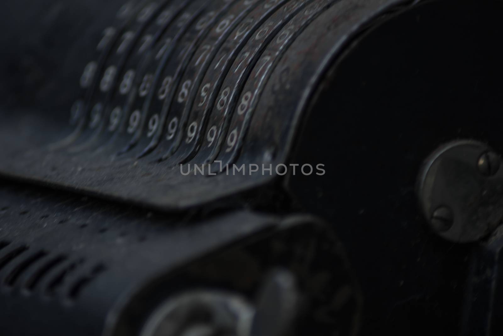 Closeup of an old vintage cash register with lots of numbers