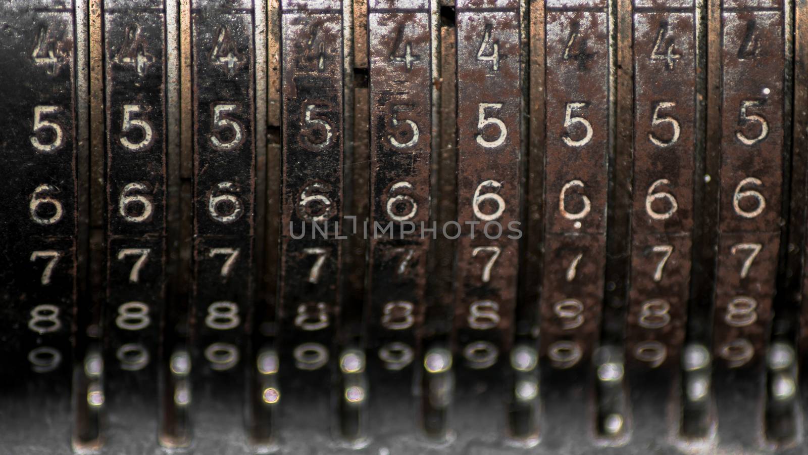 Closeup of an old vintage cash register with lots of numbers