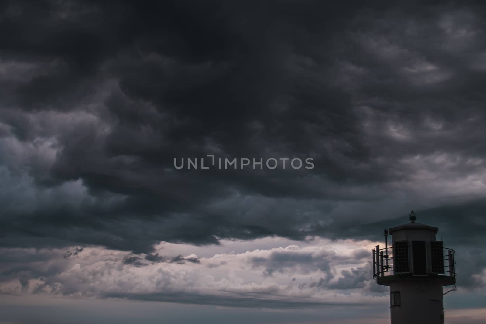 A lighthouse infront of stormy clouds by arvidnorberg