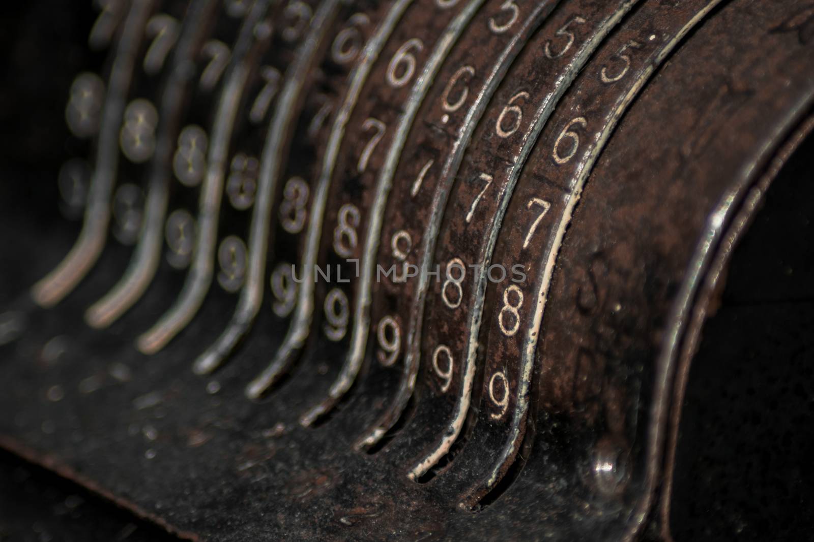 Closeup of an old vintage cash register with lots of numbers