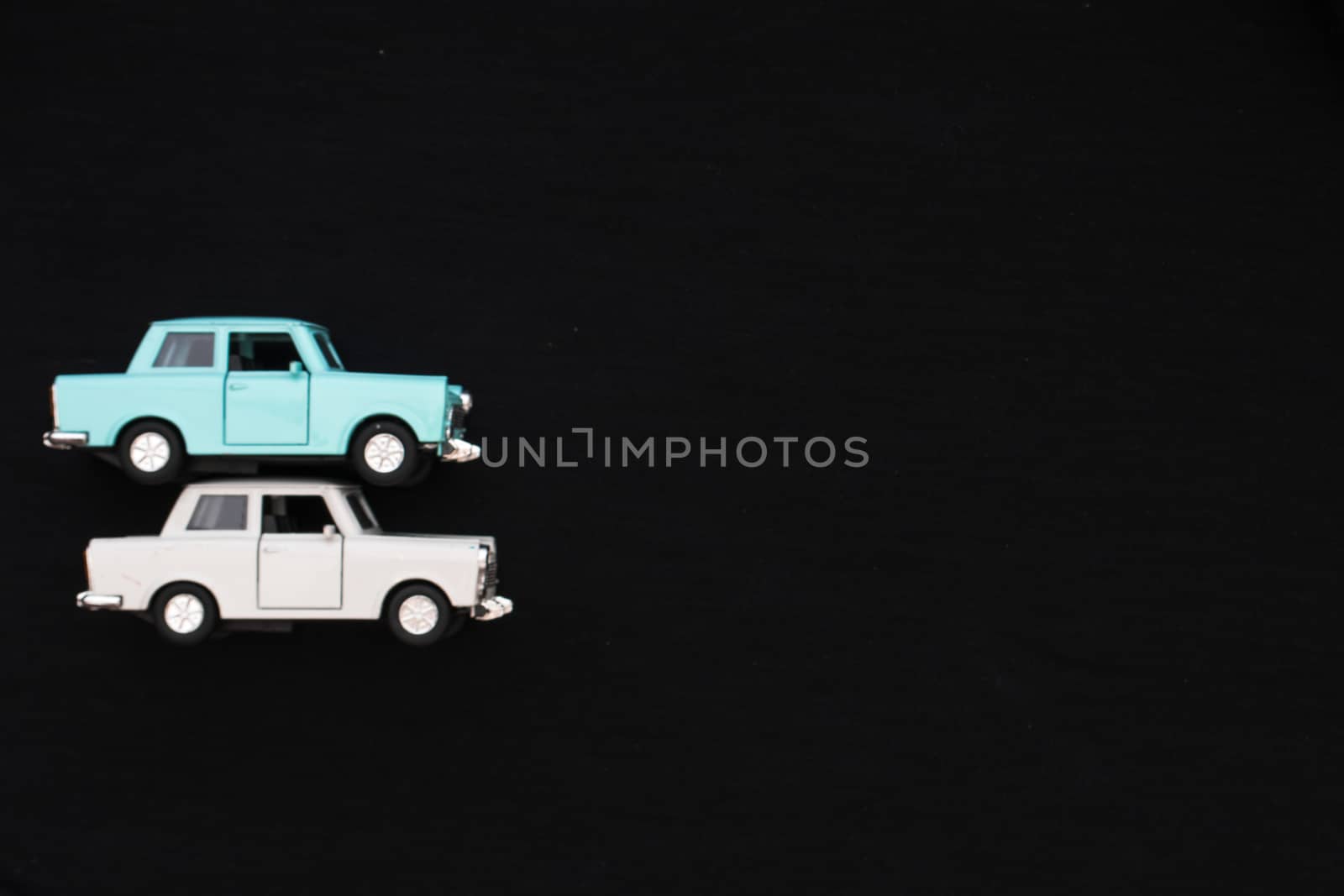 Flat lay of a white and blue toy car by arvidnorberg