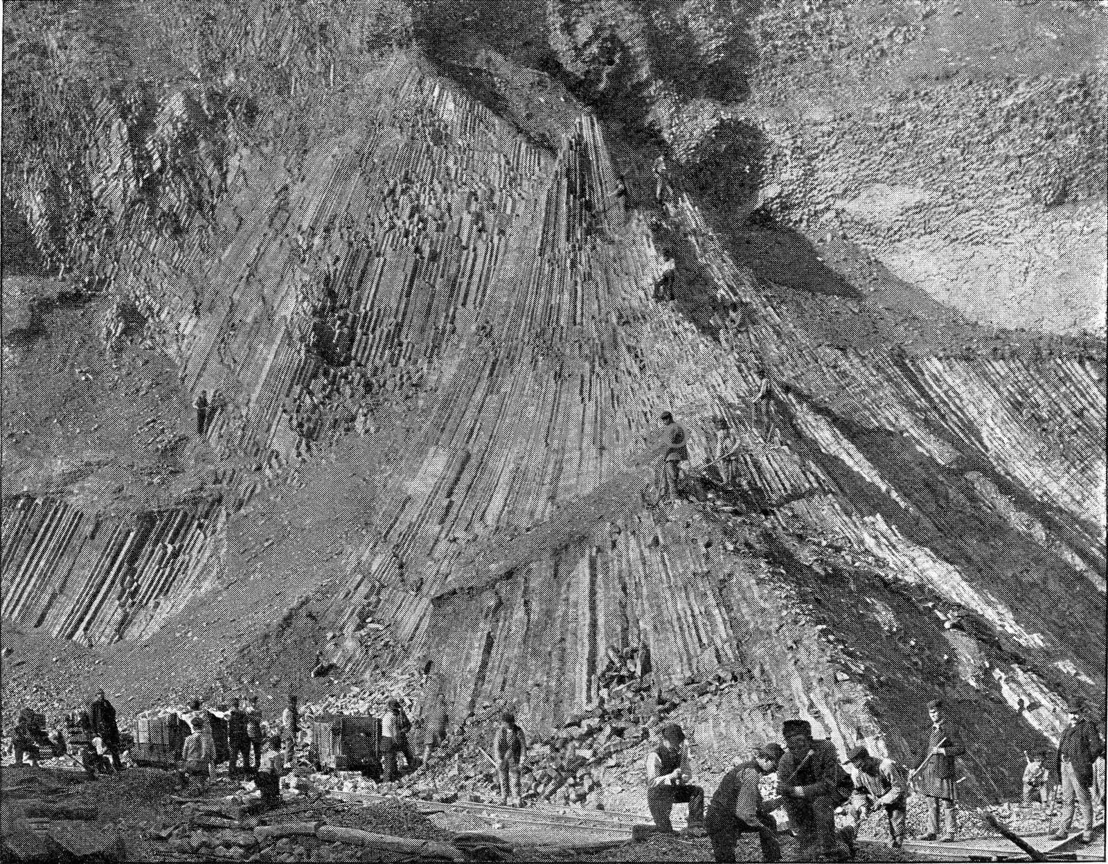 Basalt extraction on the banks of the Rhine, vintage engraved illustration. From the Universe and Humanity, 1910.
