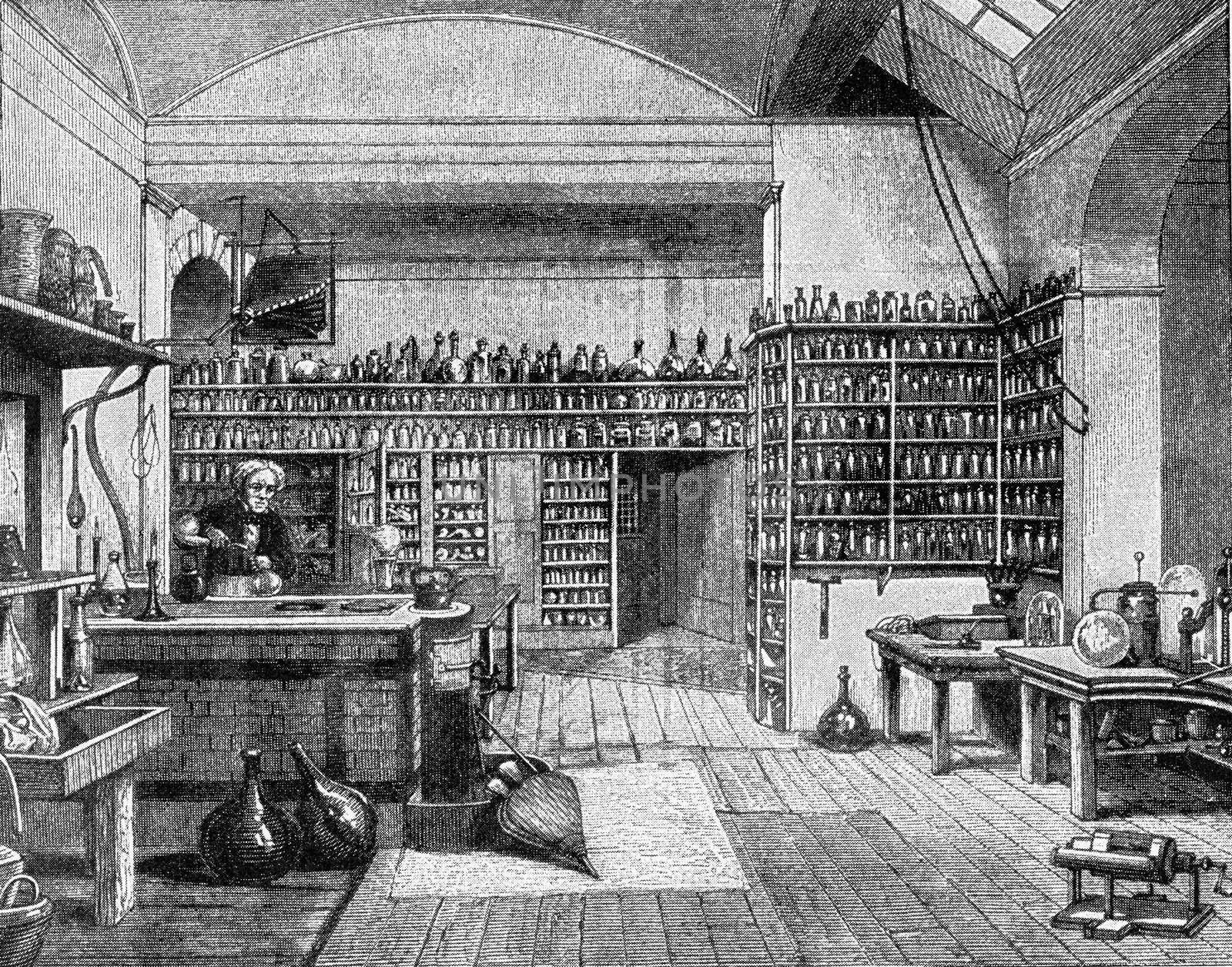 Faraday in his laboratory at the Royal Institution in London, vintage engraved illustration. From the Universe and Humanity, 1910.
