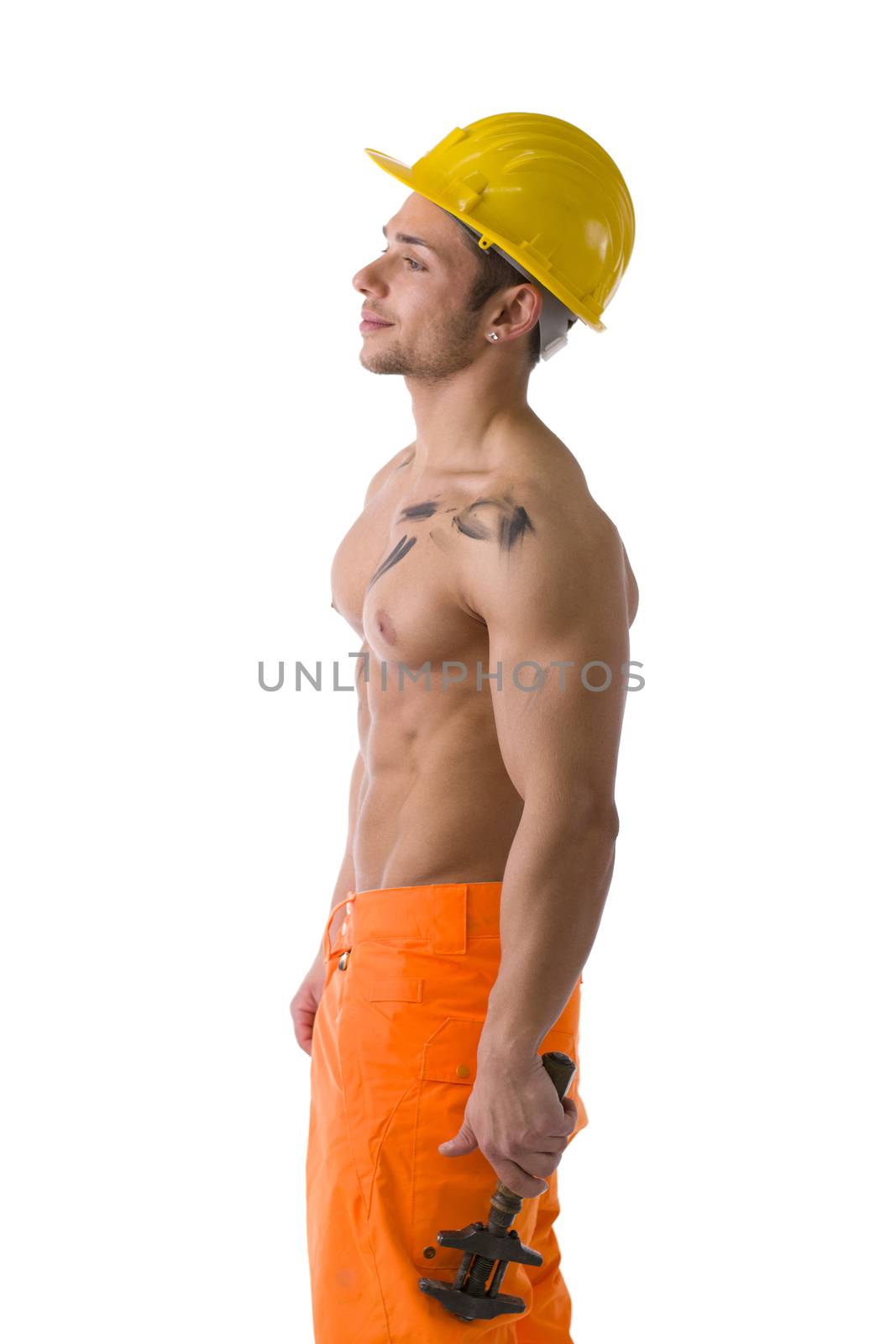 Muscular young construction worker shirtless with hardhat, isolated on white background