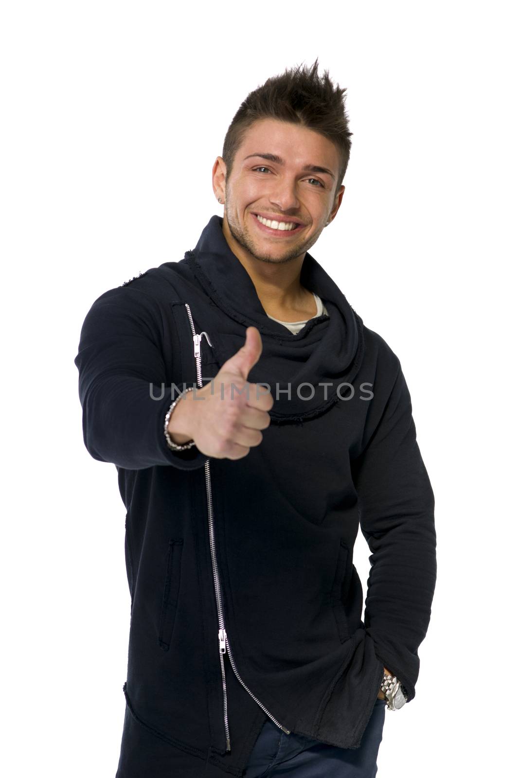 Attractive happy young man smiling, doing thumb up sign with his hand, isolated on white