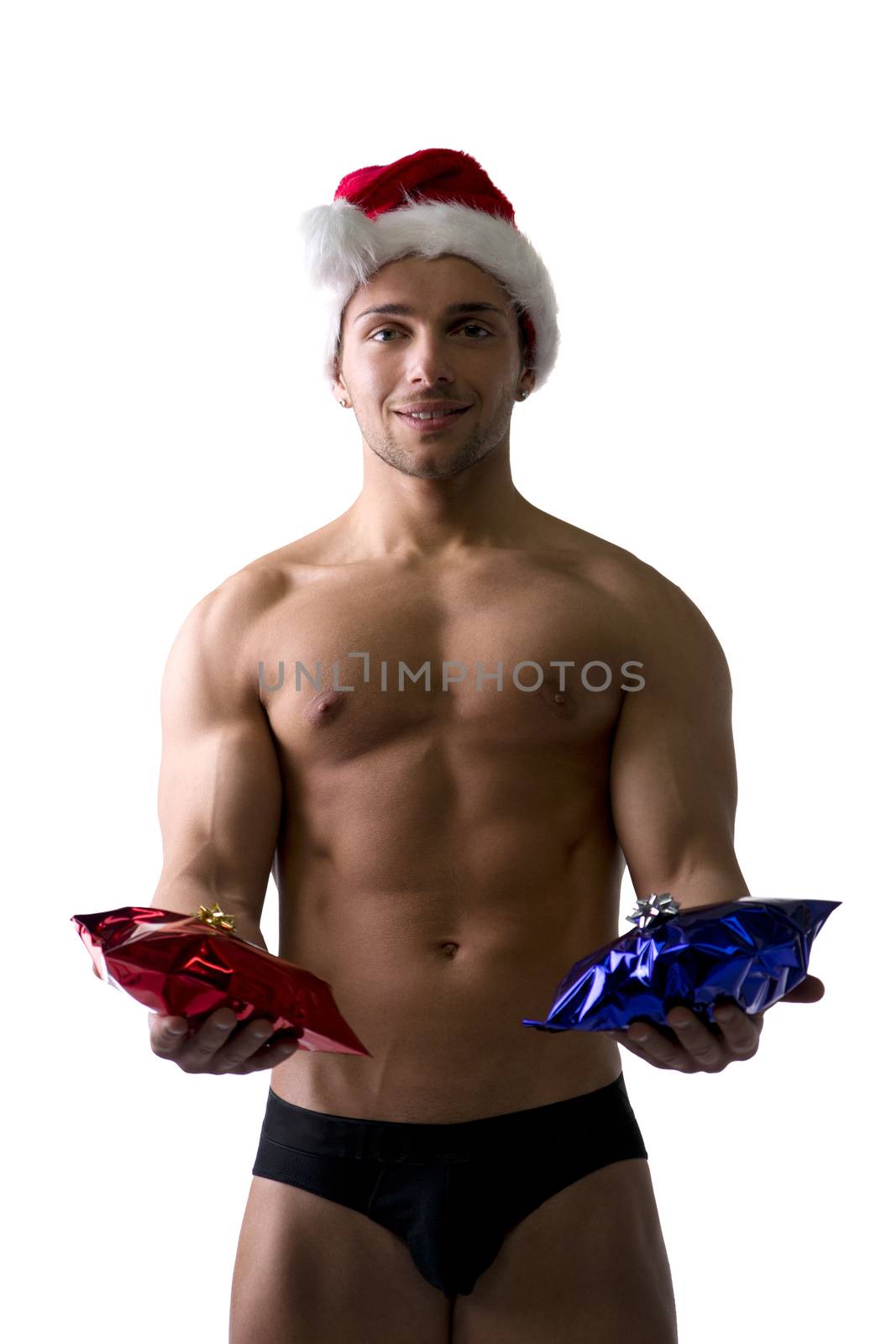 Christmas season: muscular bodybuilder shirtless wearing Santa Claus red hat, isolated on white