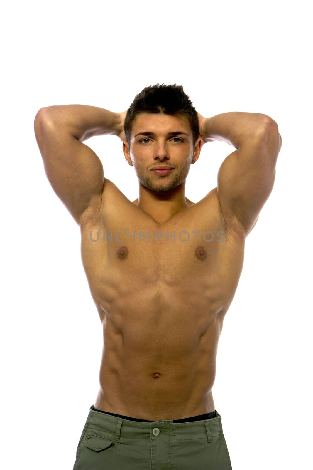 Cute muscular ripped young bodybuilder with hands behind his head, looking away. Isolated on white