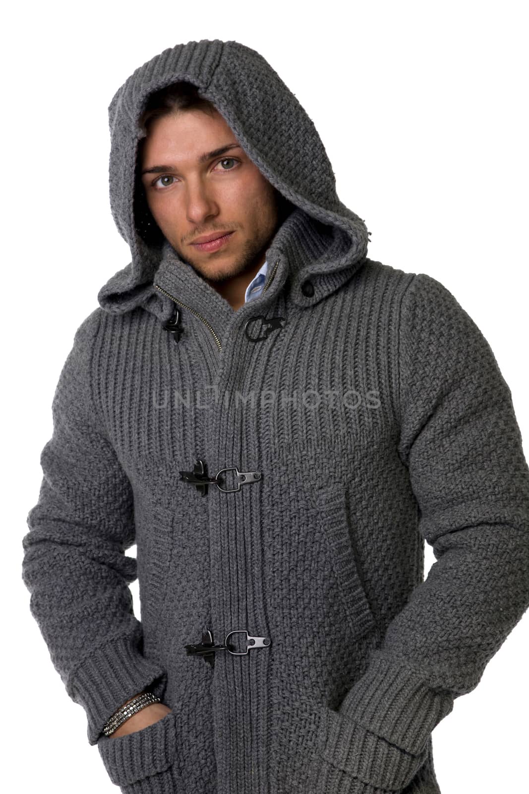Good looking young man wearing winter hoodie sweater by artofphoto