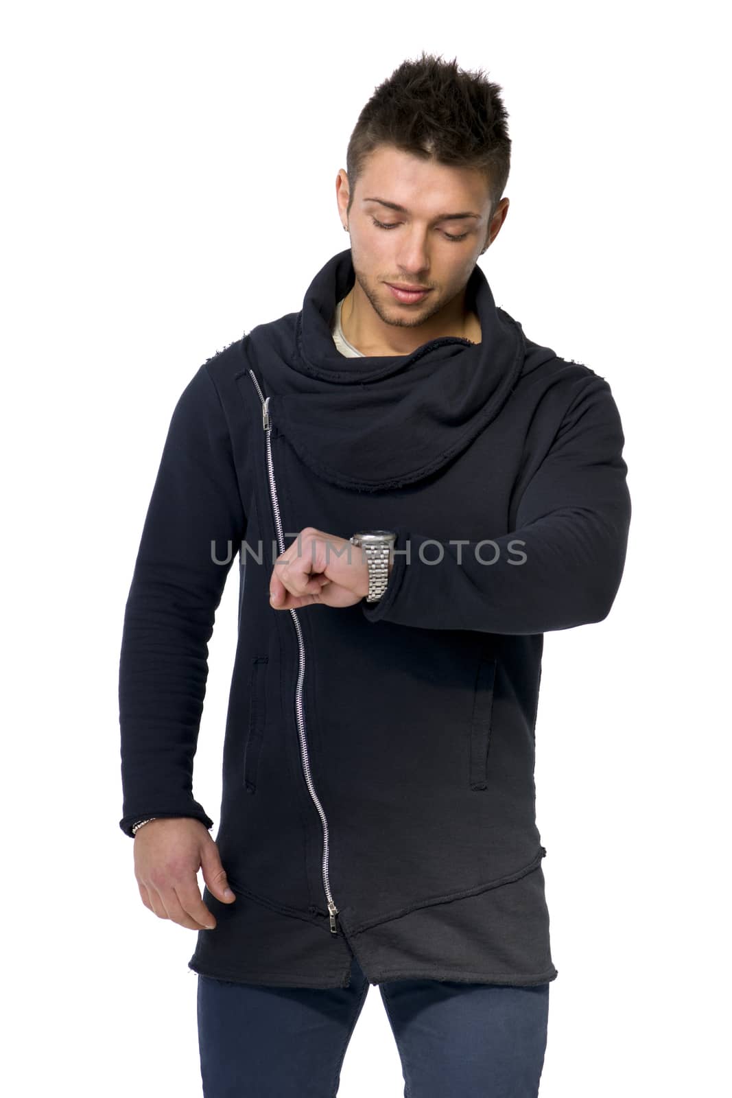 Handsome young man checking watch on his wrist, isolated on white