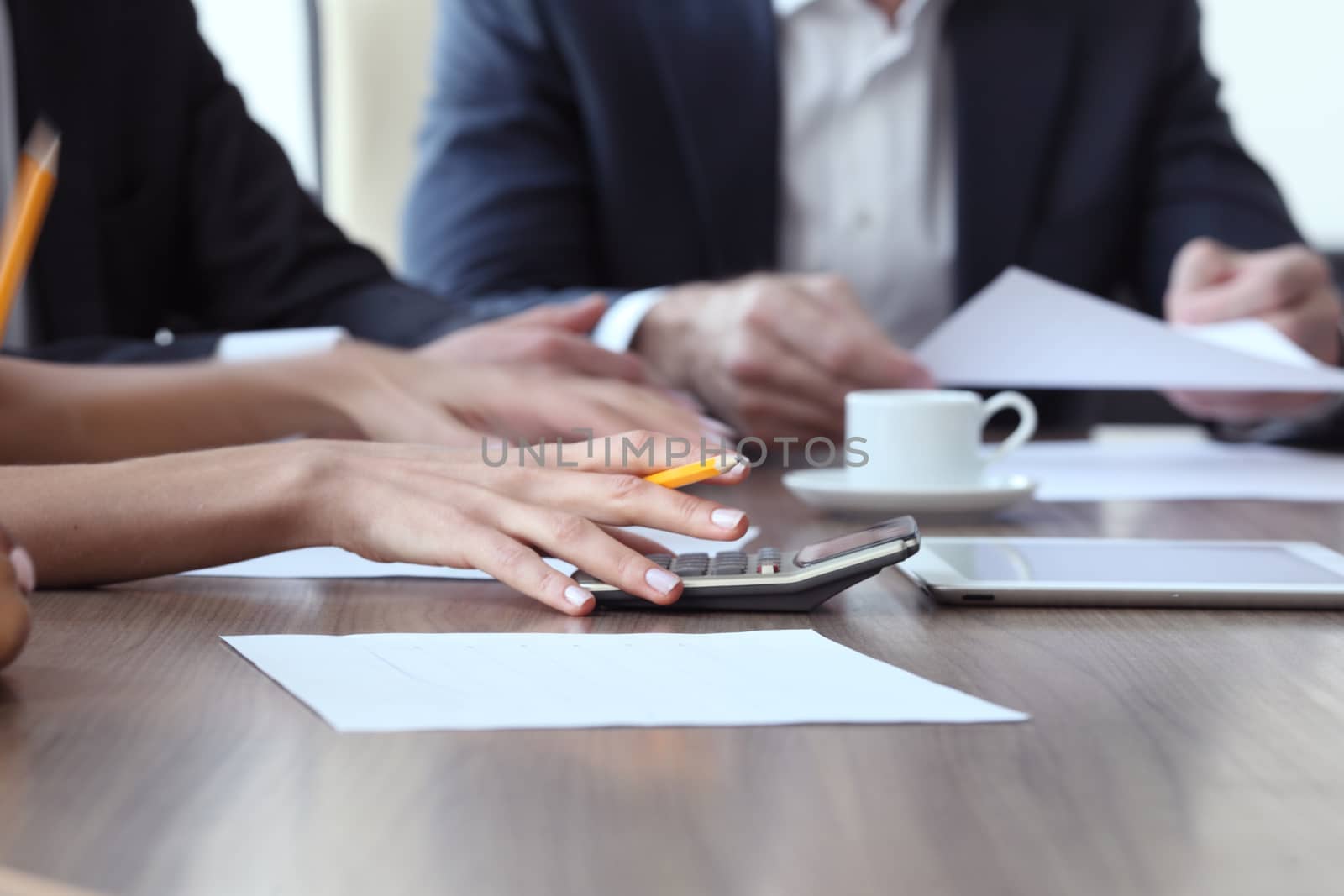 Close-up of Business people working together at meeting