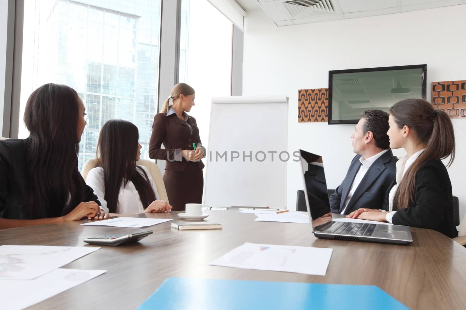 Business presntation on meeting of diverse people around the table