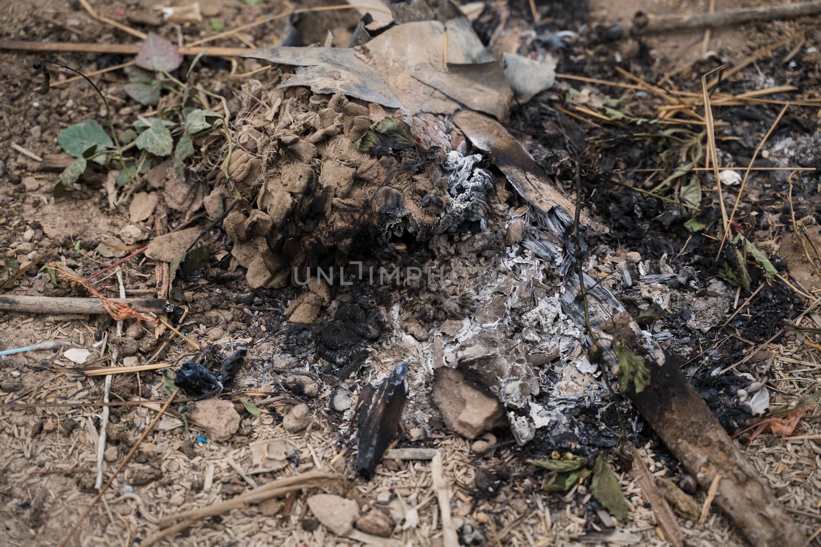 Extinguished coals. Ashes and coals. The place where the bonfire was. Old bonfire.