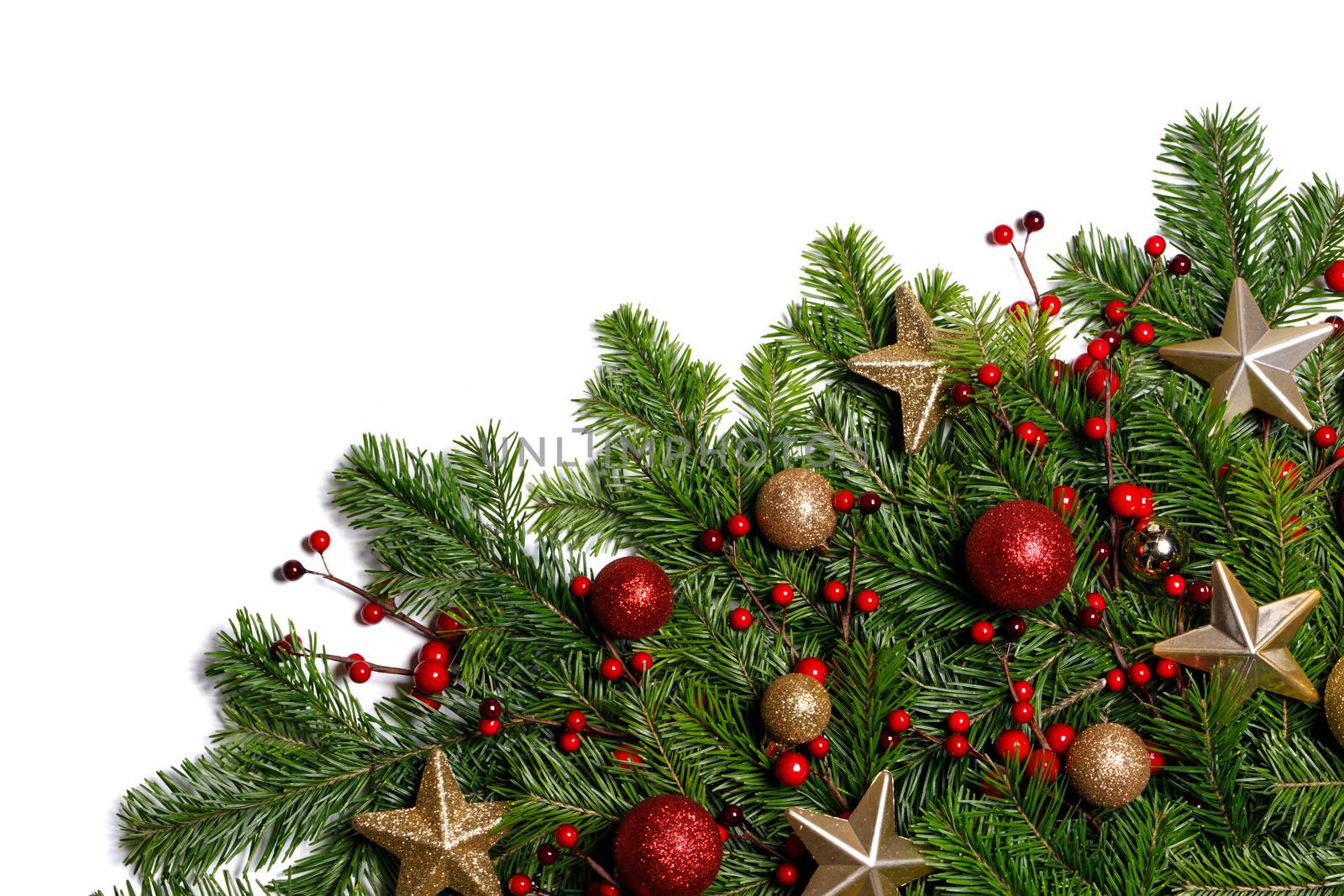 Christmas Border frame of tree branches on white background with copy space isolated, red and golden decor, berries, stars