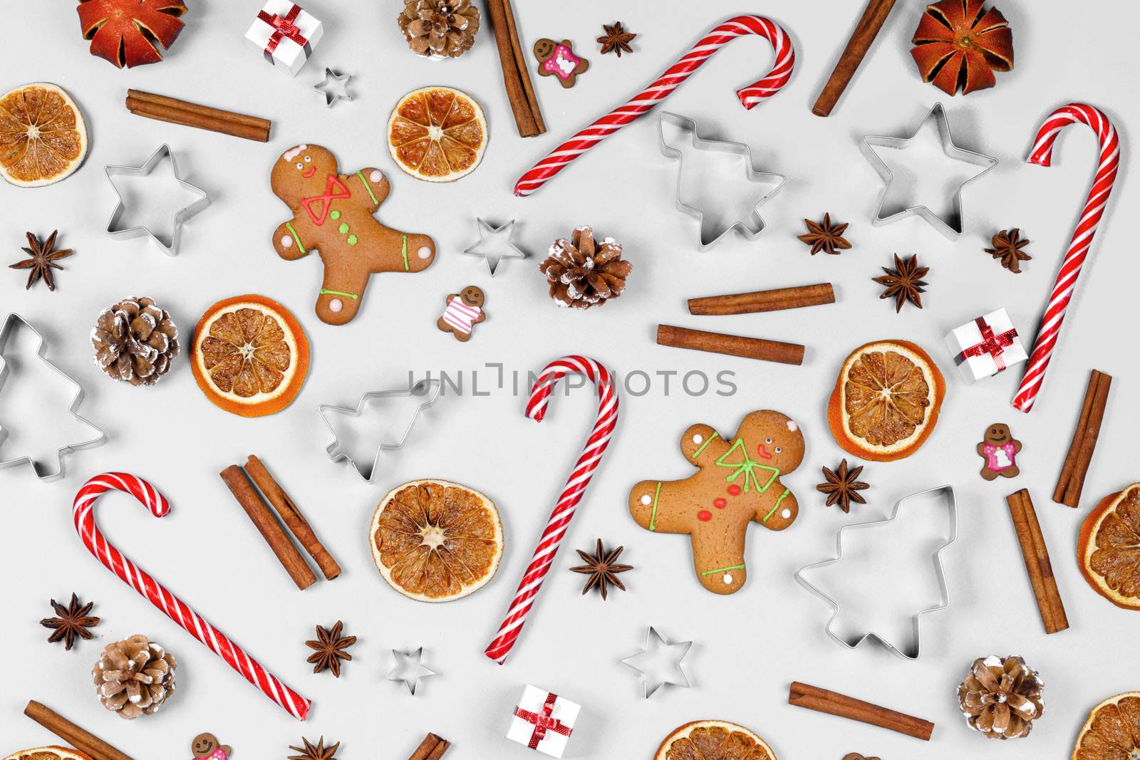 Christmas food frame. Gingerbread cookies, spices and decorations on white background with copy space