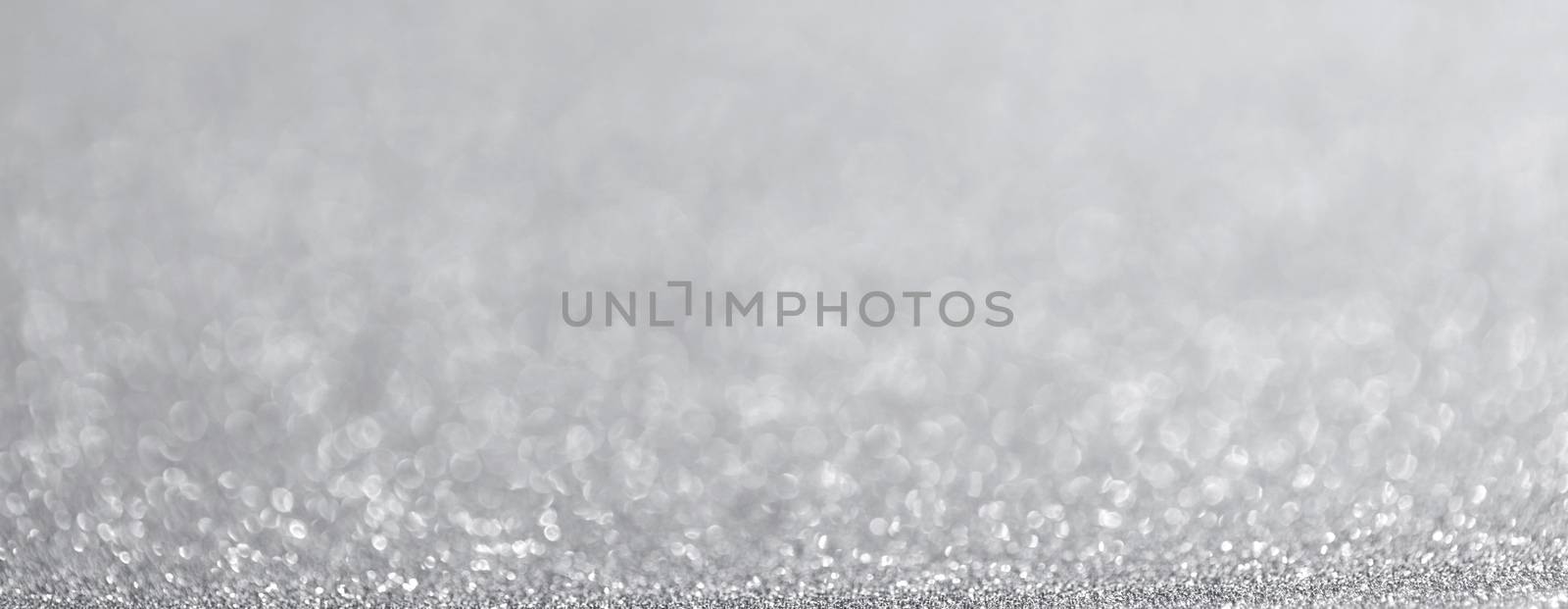 Abstract silver glitter light bokeh holiday party background