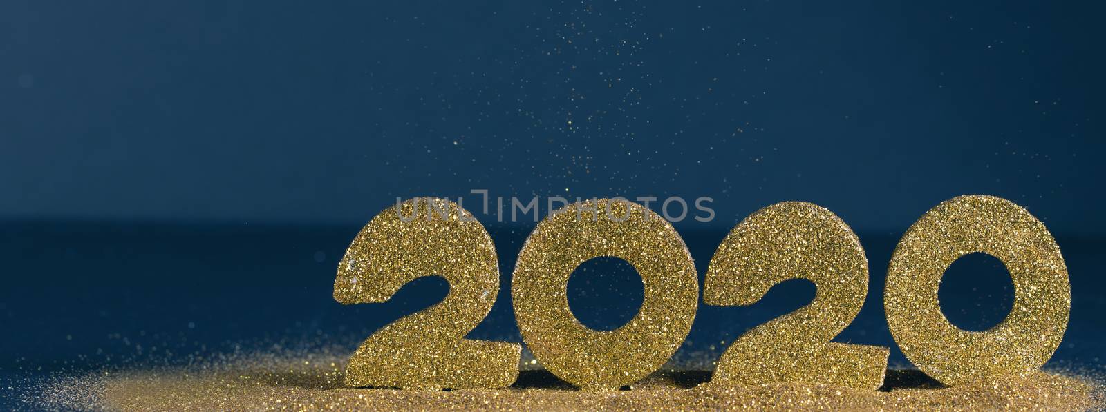 2020 New Year luxury design concept. Golden 2020 New Year horizontal template with golden glitter on blue backgound