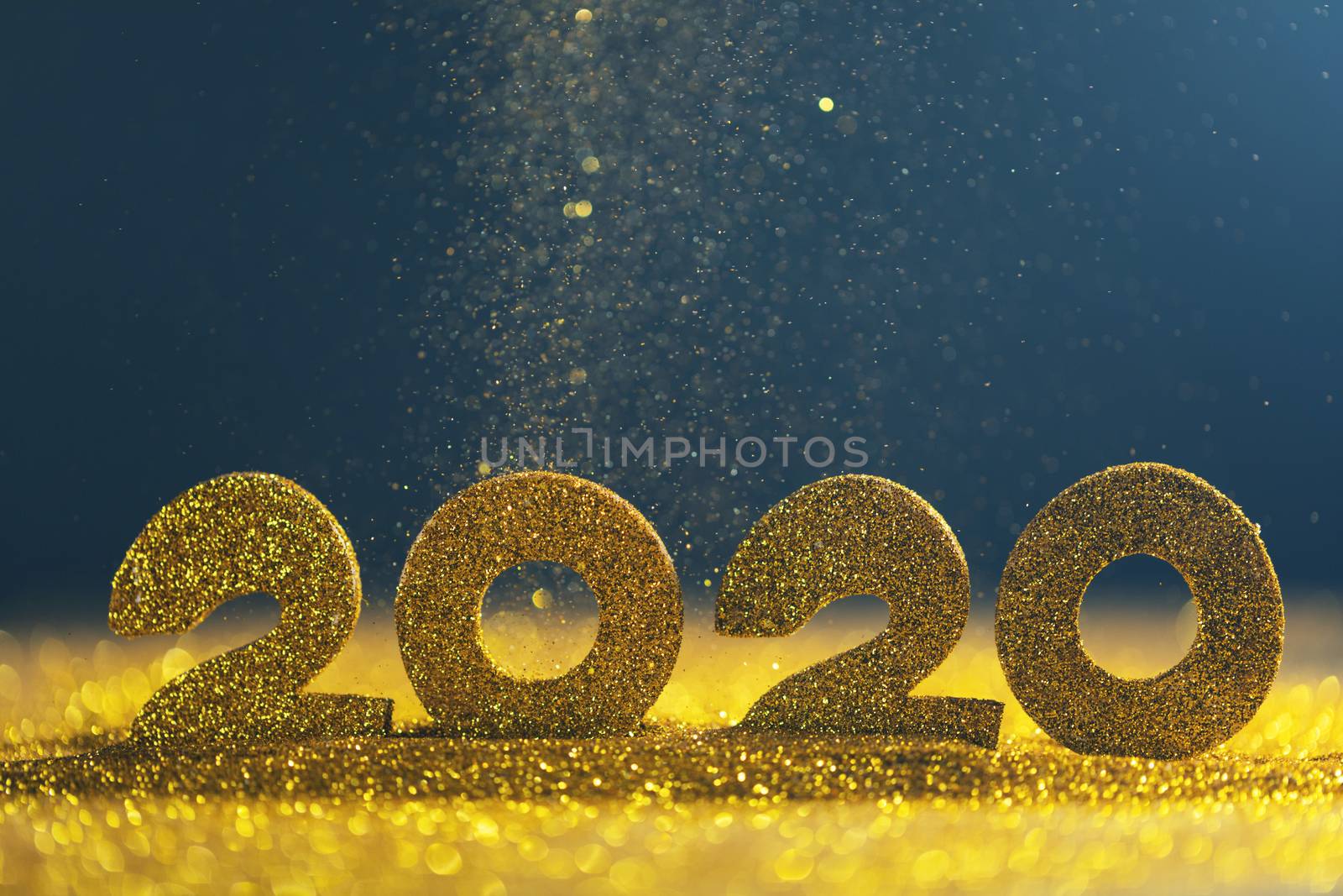 2020 New Year luxury design concept. Golden 2020 New Year horizontal template with golden glitter on blue backgound