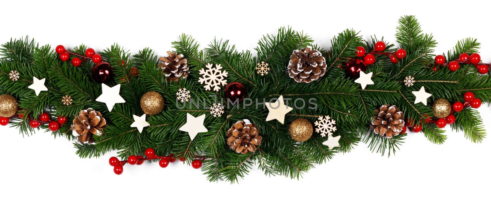 Christmas Border frame stripe of tree branches on white background with copy space isolated, red and golden decor, berries, stars, cones