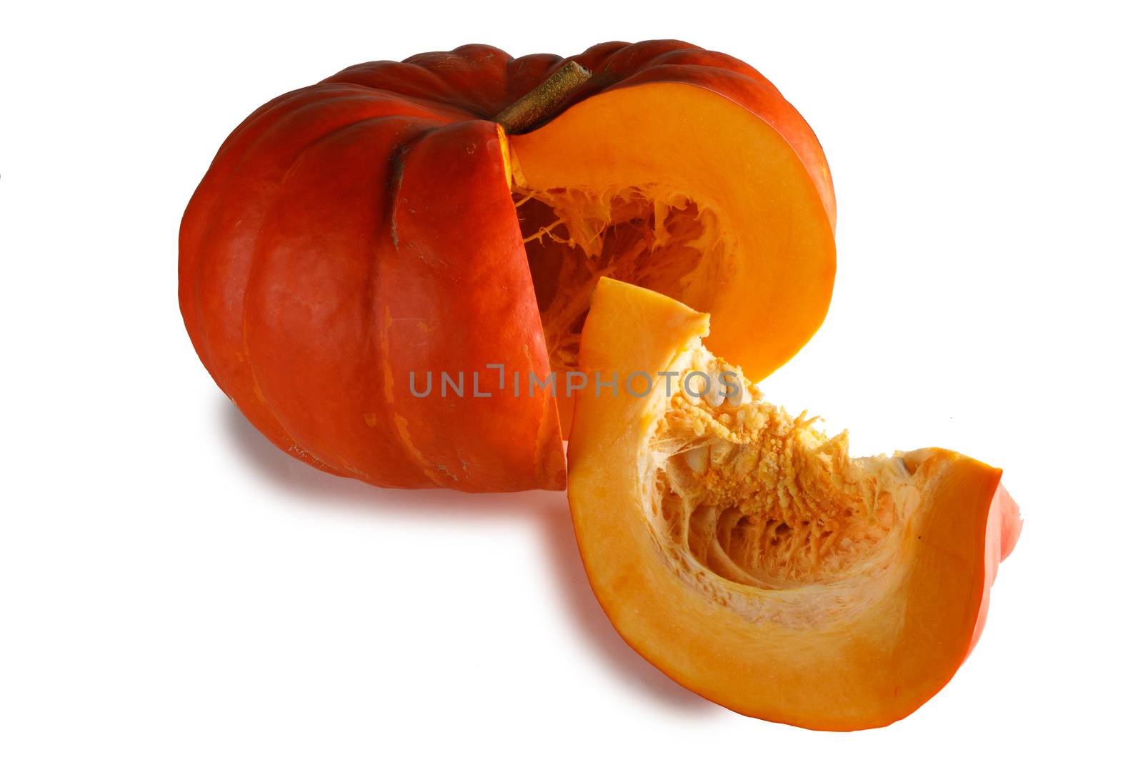 Cut orange pumpkin isolated on white background