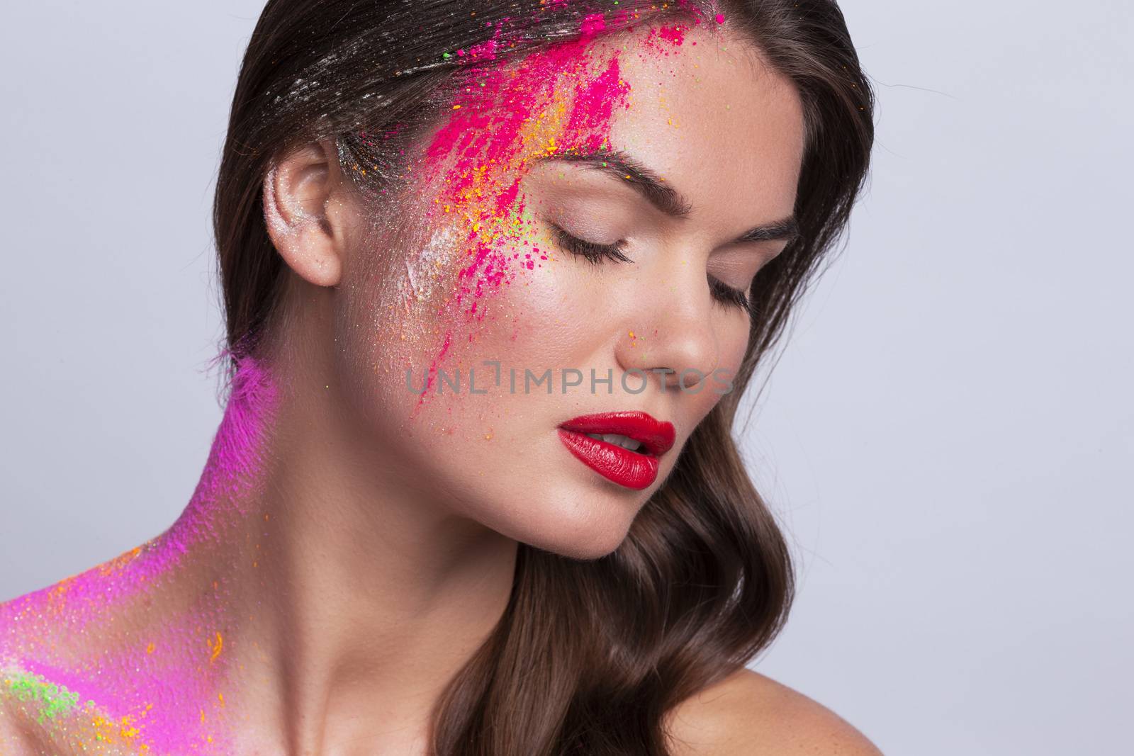 Woman face with colorful makeup by ALotOfPeople