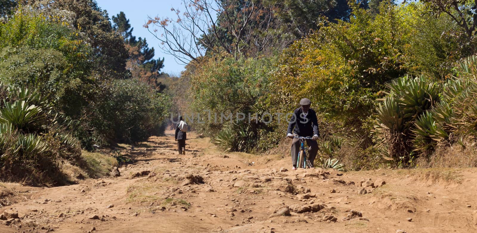 Old man walking on a bad road on Madagascar, Africa