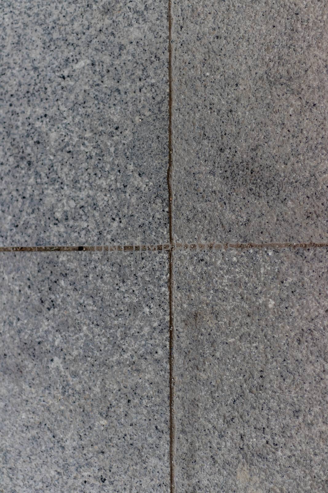 gray pointy and dirty pavement stone square parts centered with good composition. photo has taken from izmir/turkey.