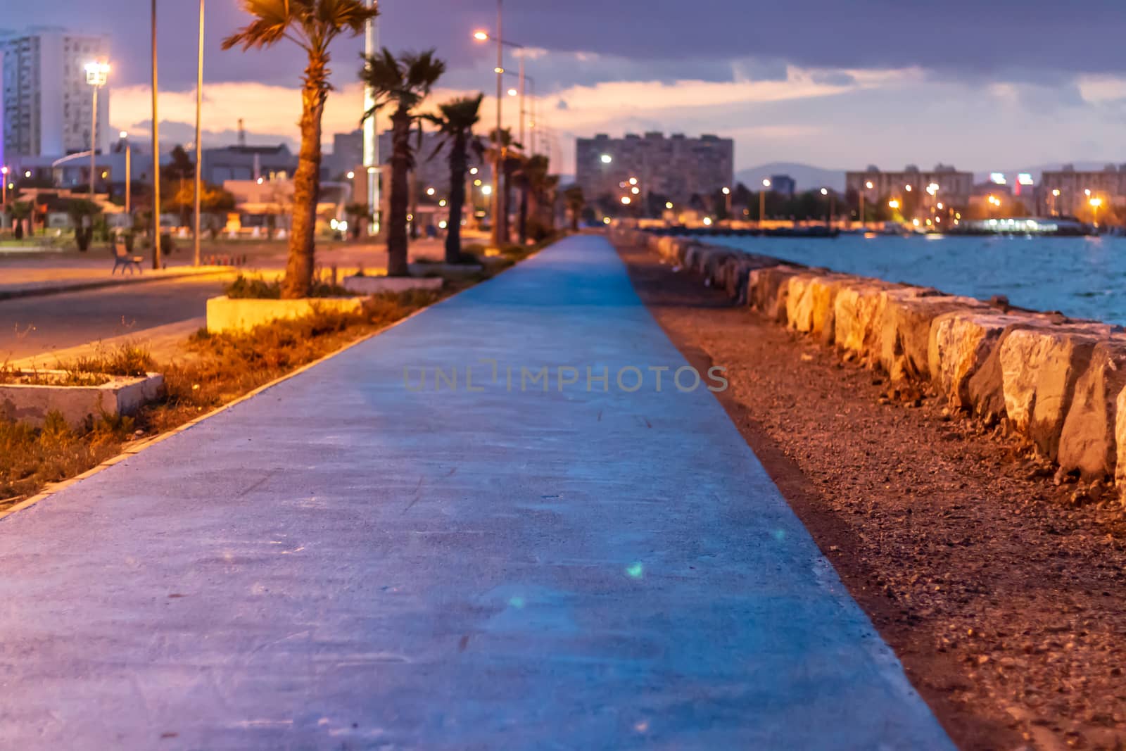 a narrow shoot from mavisehir coast at night - city, sea and coast composed very well. photo has taken from izmir/turkey.