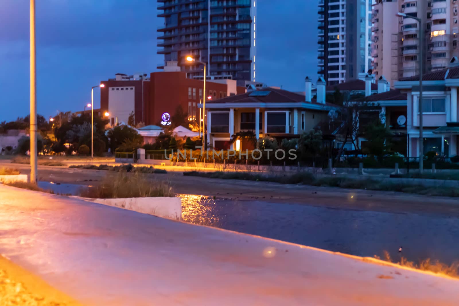 nice looking blue color dominated night cityscape shoot with city lights and buildings. photo has taken from izmir/turkey.