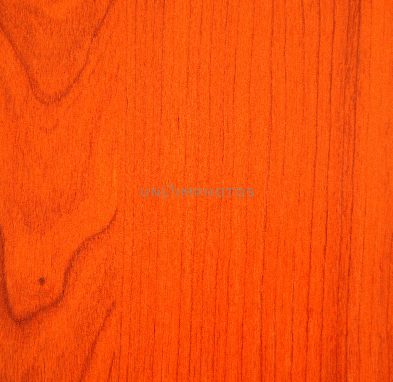Red cherry, a natural drawing of a wood texture on a cut. Close-up.