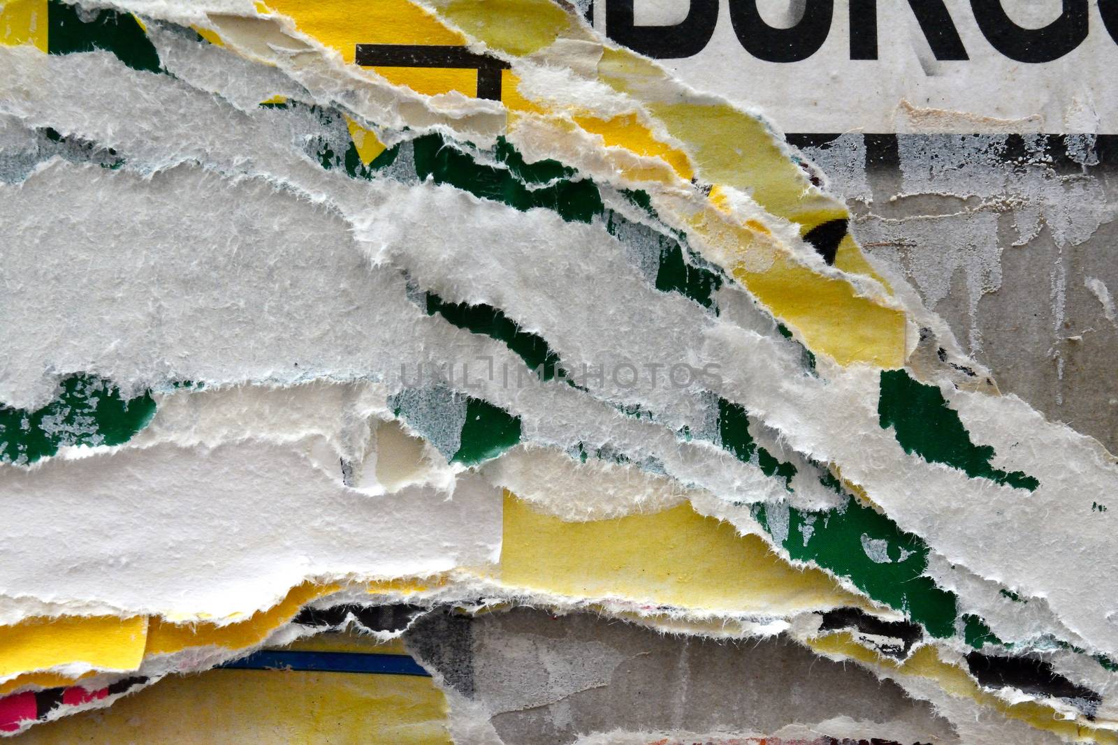 background photo of torn layers of poster paper by megnomad