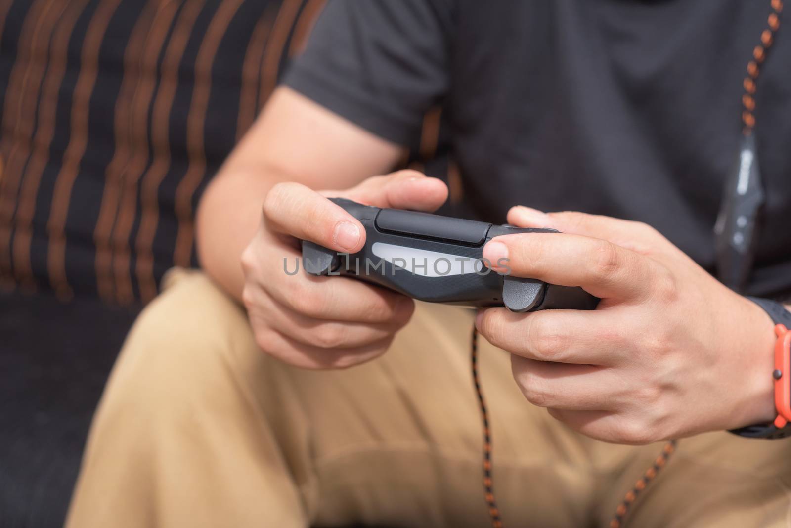 Young man playing video games by HERRAEZ