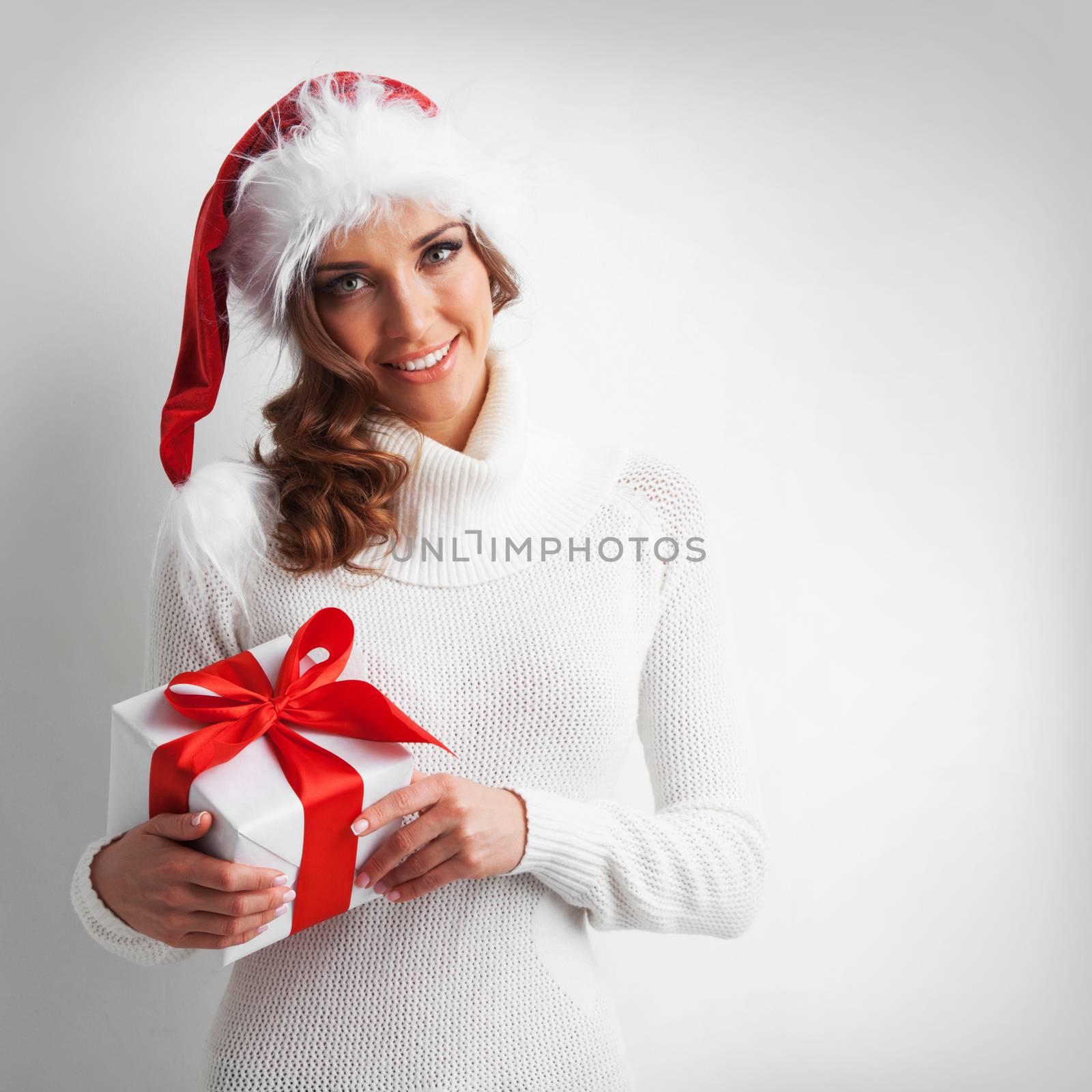 Santa girl holding christmas gift by Yellowj