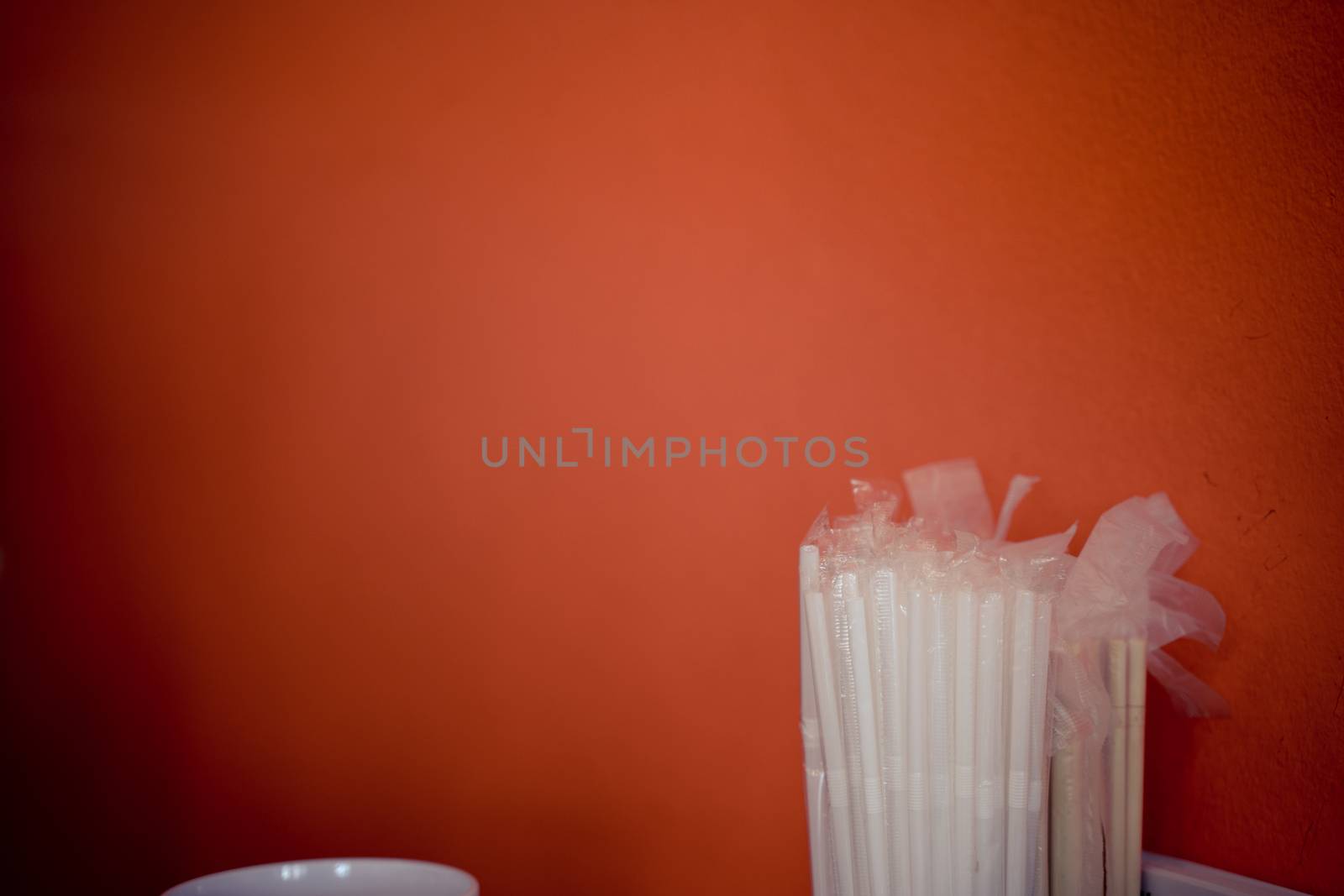 The drinking straws for the color background. Abstract a colorful of plastic straws used for drinking water or soft drinks. Selective focus. Copy space