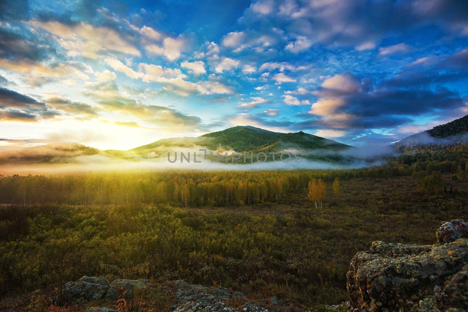 Sunrise in Altai mountains nature reserve. The beginning of autumn, September