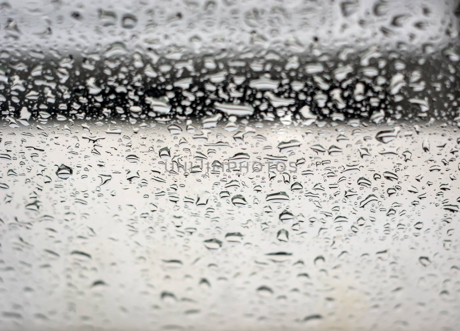 Raindrops on the window, abstract background. Seasonal concept