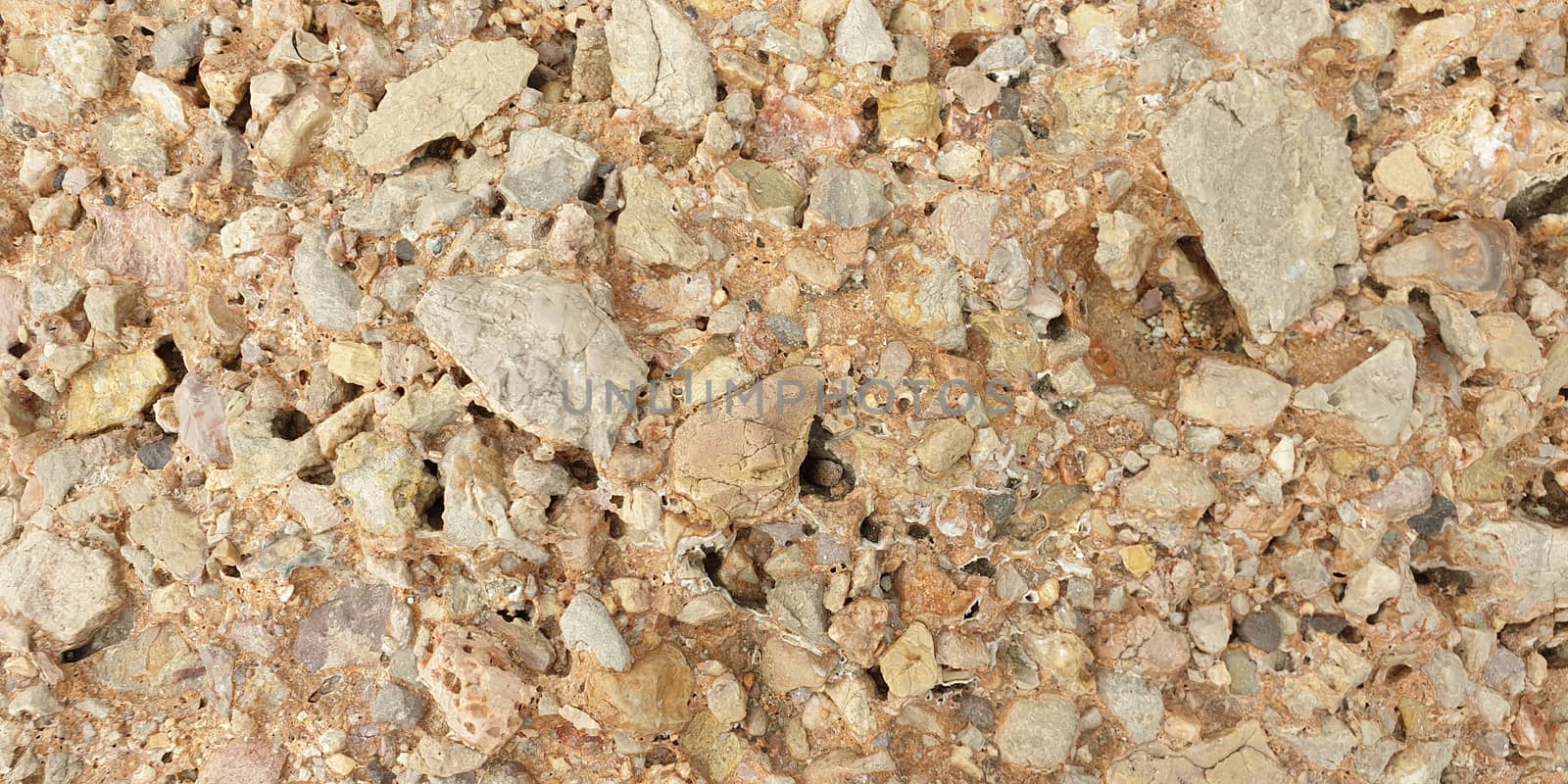 Texture of colorful Mediterranean stone on the shore