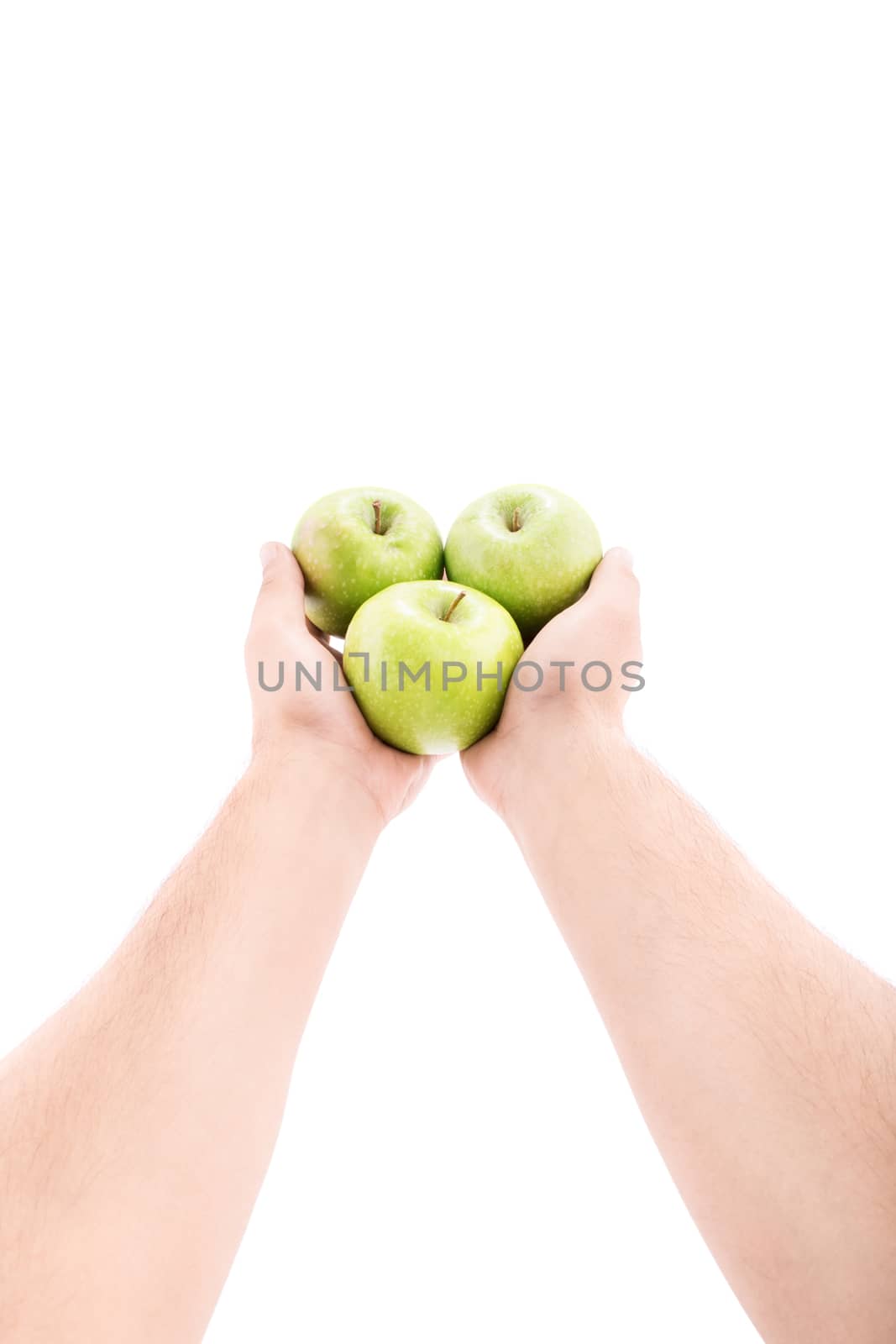 Stretched out male hands offering green apples, isolated on white background.
