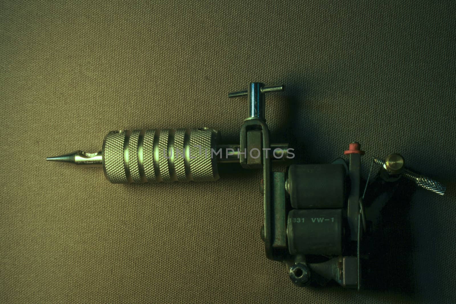 tattoo machine, with accessories and needles, tubes made in color background