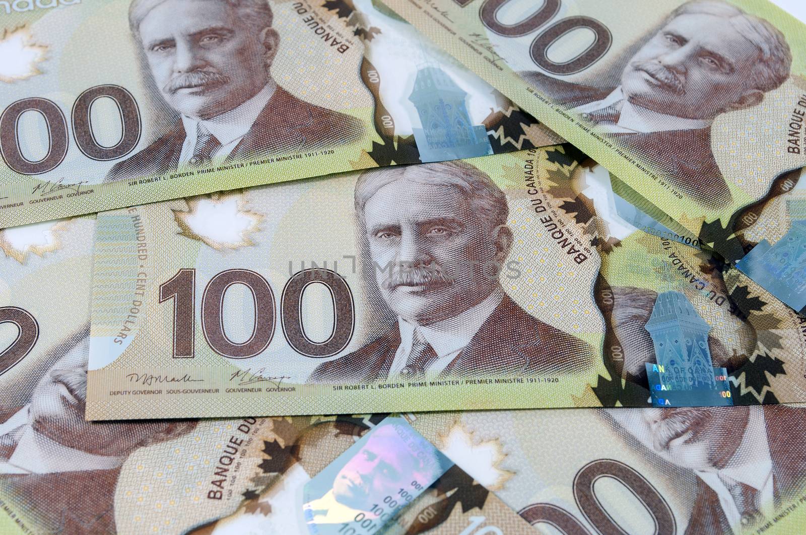 Close up view of new 100 Canadian dollar banknotes.