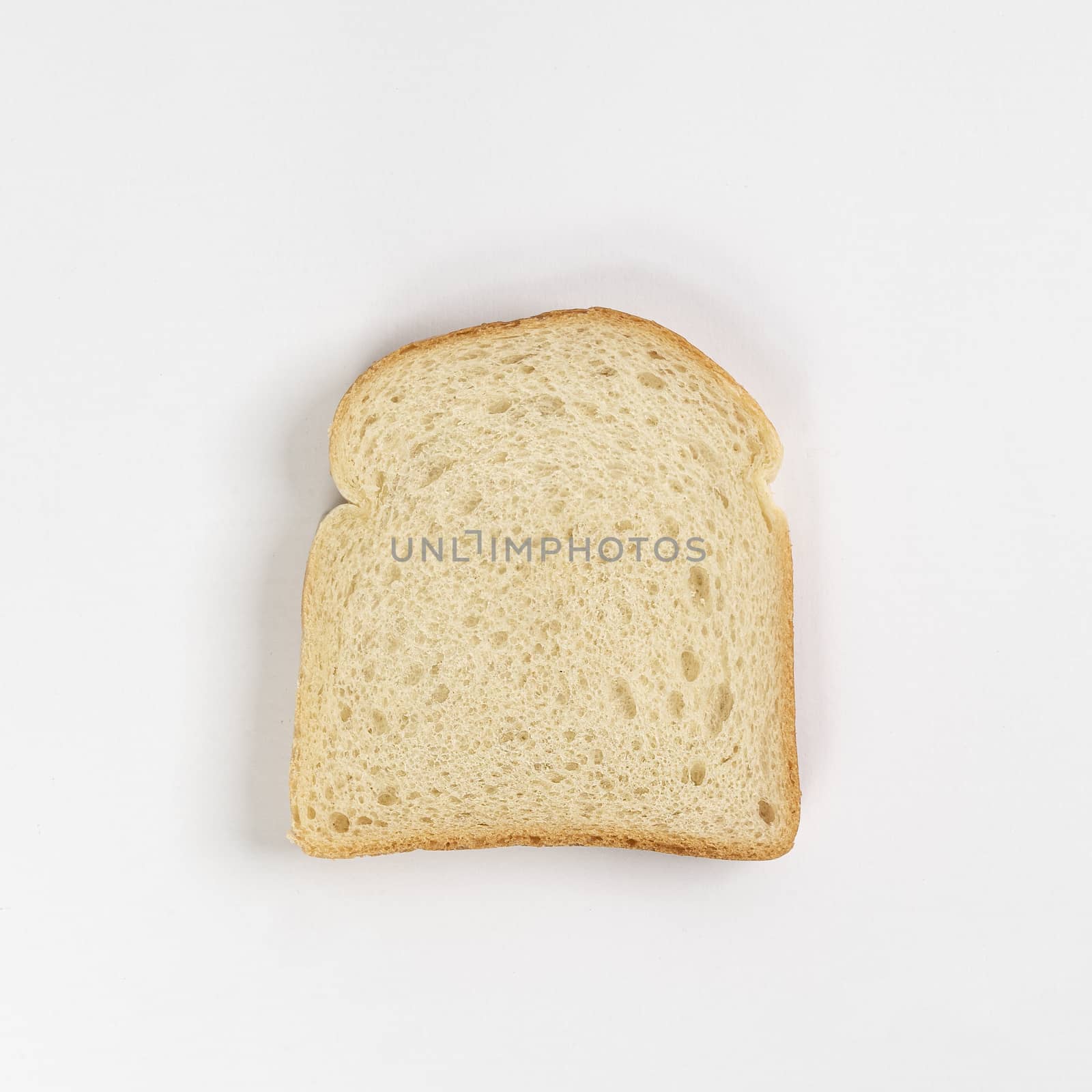 A slice of bread on a white surface