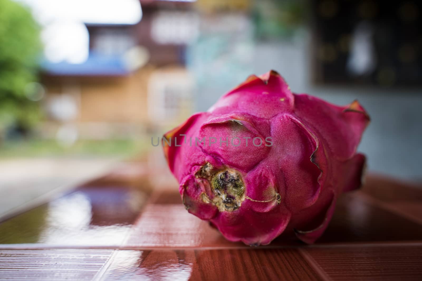 A Dragon fruit. (tropical fruit) on wooden background