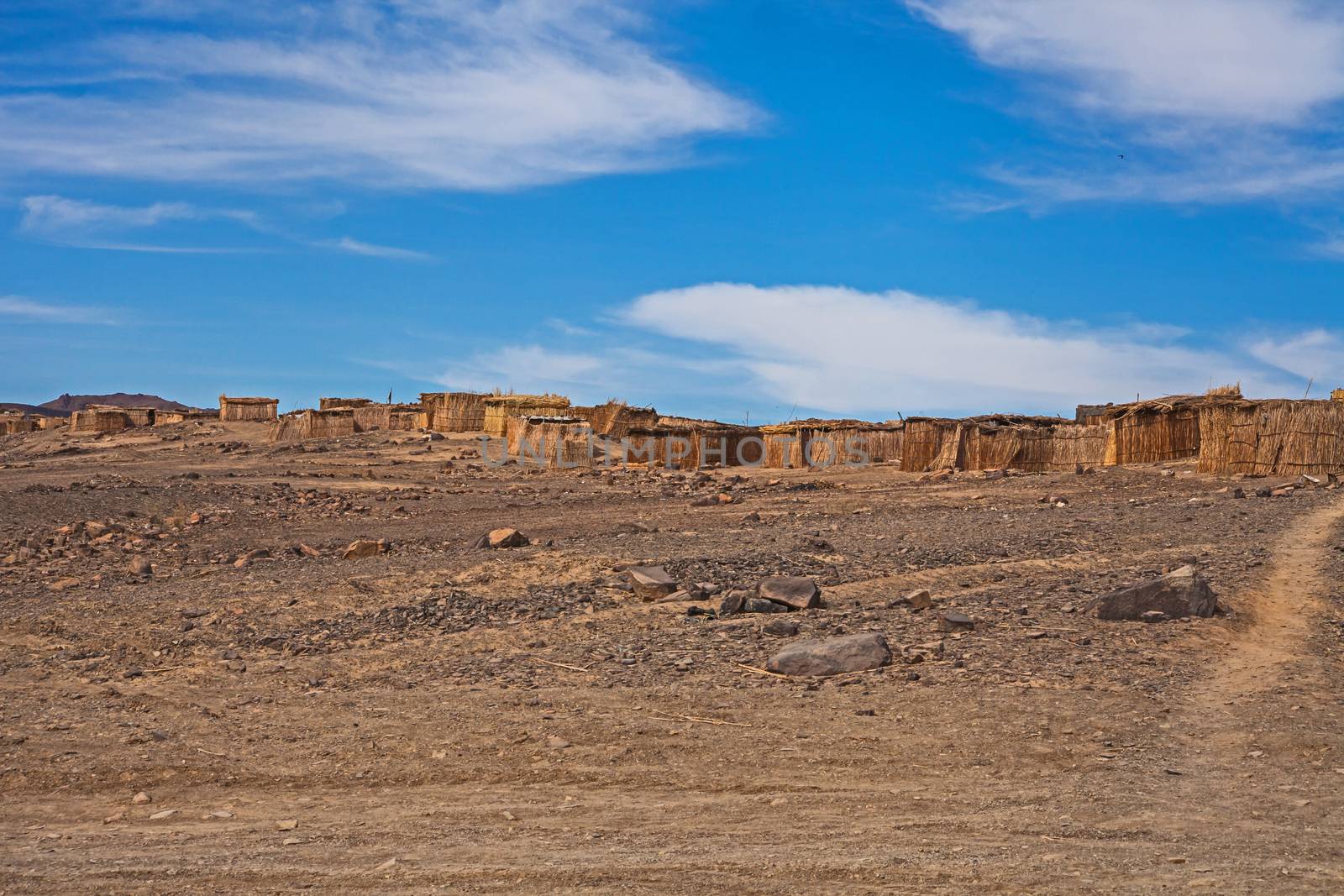 The houses are constructed with reeds from the banks of the Orange River in an attempt to escape the extreme desert climate of southern Namibia.