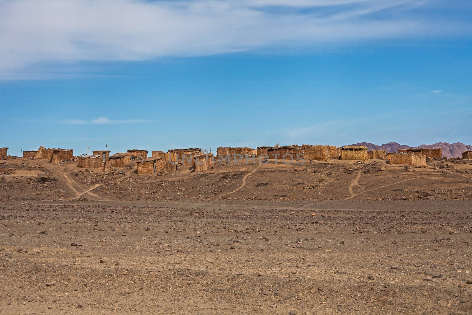 The houses are constructed with reeds from the banks of the Orange River in an attempt to escape the extreme desert climate of southern Namibia.