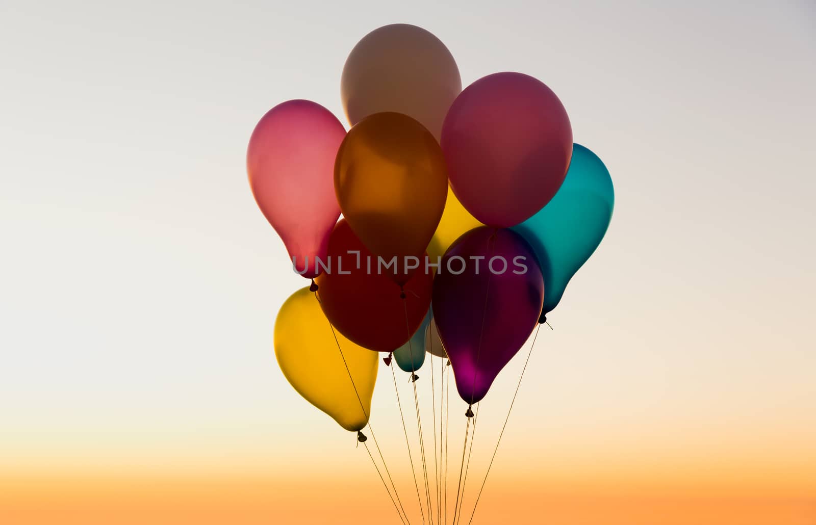 Colored balloons agrains a blue sky