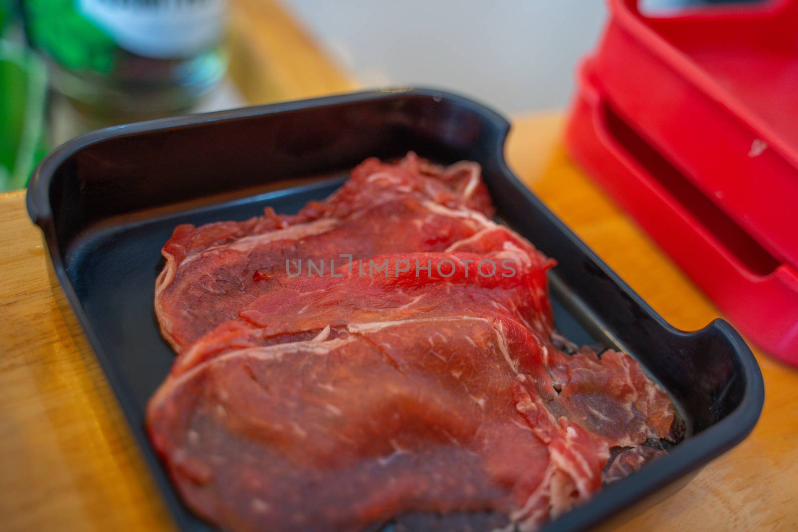 The Peppered roast beef pastrami slices on black plate