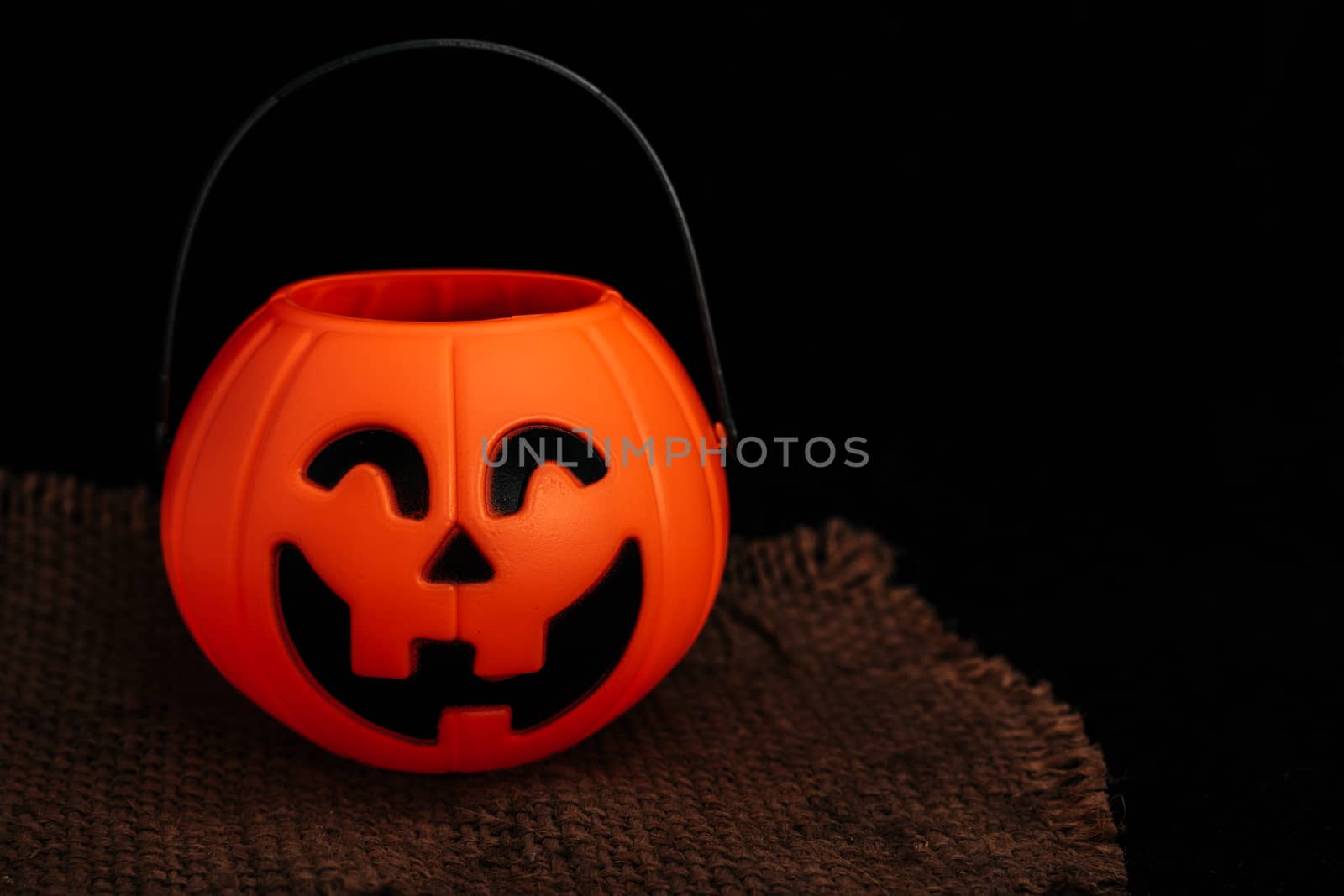 Halloween pumpkin on dark background with space for text by peerapixs